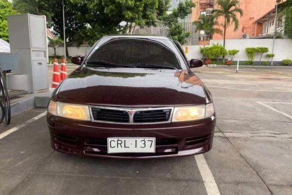 Red Mitsubishi Lancer 2000 Sedan at 113000 km for sale in Manila