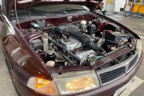 Red Mitsubishi Lancer 2000 Sedan at 113000 km for sale in Manila