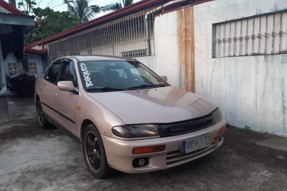 Selling Brown Mazda 323 1997 in San Pedro