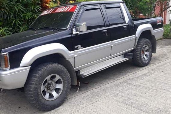 Selling Black Mitsubishi Strada 1995 in Davao