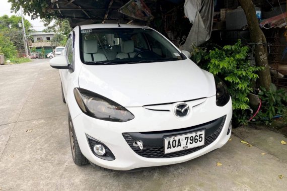 White Mazda 2 2014 model