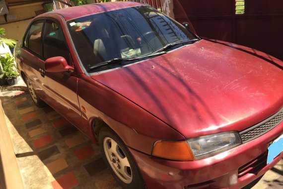 Need to sell Red 1997 Mitsubishi Lancer Sedan second hand