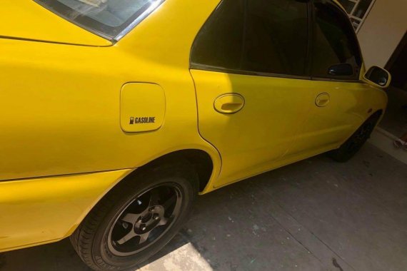 Yellow Mitsubishi Lancer 1994 for sale in Pateros