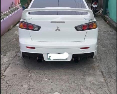 Pearl White Mitsubishi Lancer 2010 for sale in Quezon City