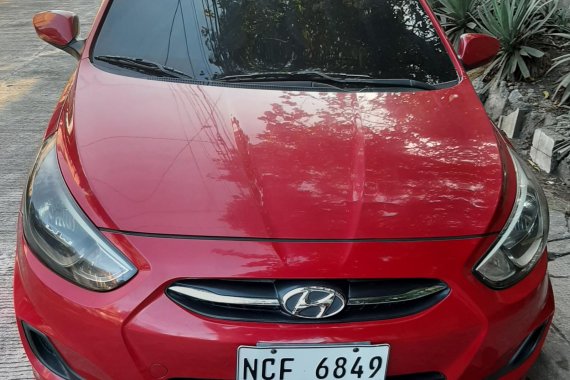 Red Hyundai Accent hatchback 2016