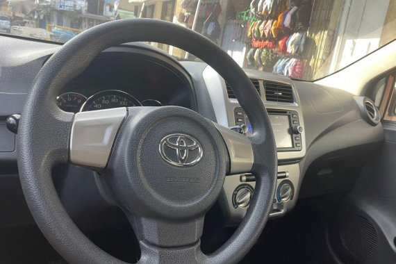 Pearl White Toyota Wigo 2014 for sale in Quezon City