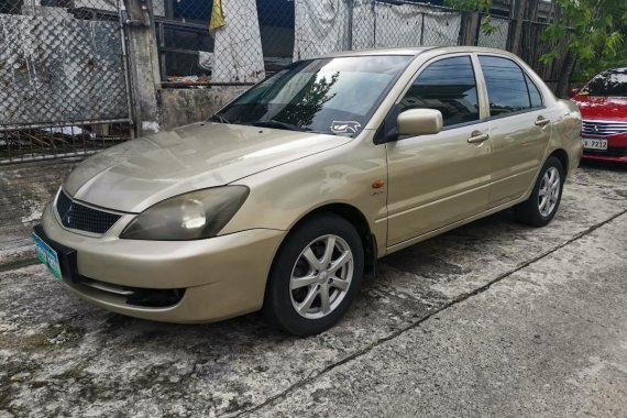 Selling Golden Mitsubishi Lancer 2010 in Imus