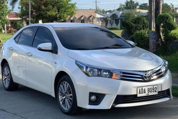 Pearl White Toyota Corolla Altis 2014 for sale in Calasiao