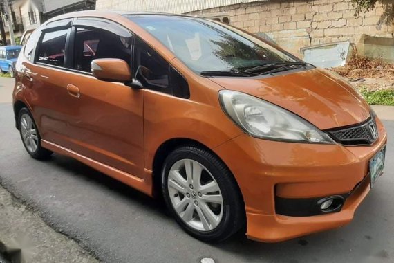 Orange Honda Jazz 2013 for sale in Quezon City