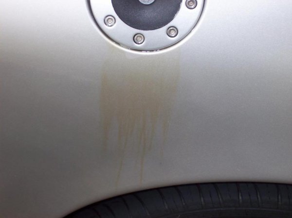 When gas tank overflows, the gasoline will evaporate then leave the stains. gas tank overflows