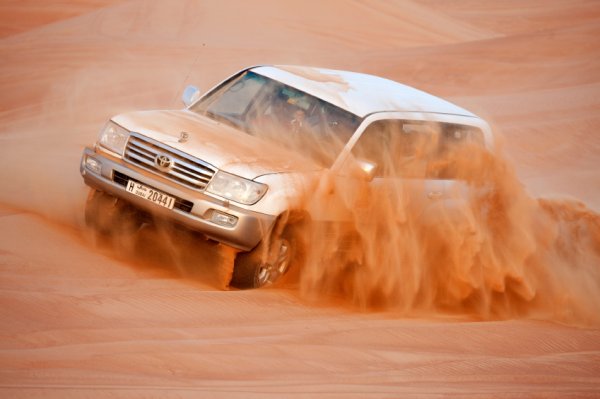 Keep the windows up if you don’t want your car to be covered in a mess of dust and sand. Sand grimes your vehicle