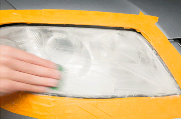 Wet a piece of 1,000-grit sandpaper to scuff away the outer layer of haze. scuff away the outer layer of haze
