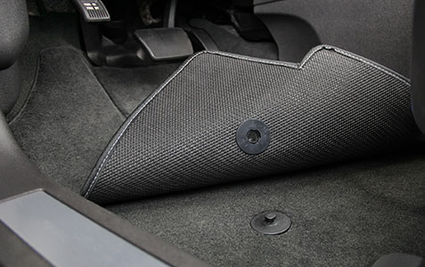 Remove the foot mats and check for any moist and wet spots. Foot mats
