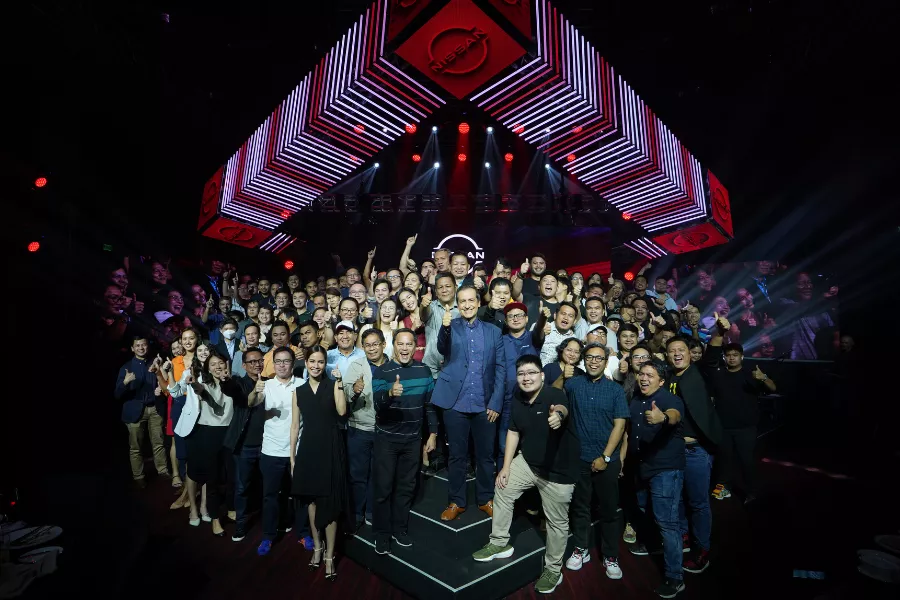 A picture of the Nissan PH posing with automotive journos.