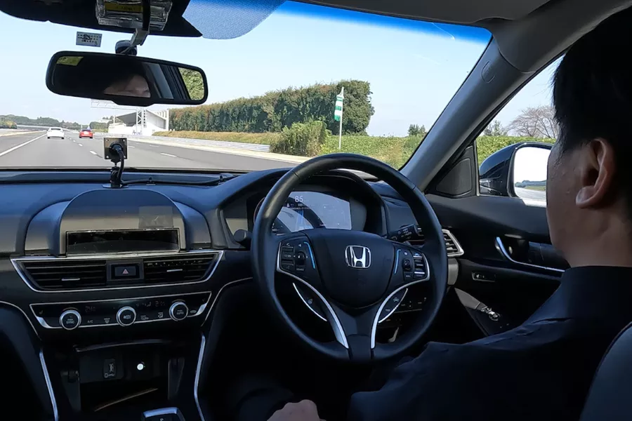 A picture of Honda techs testing the Honda Sensing Elite hands-free function