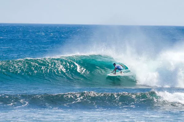 A boy surfing