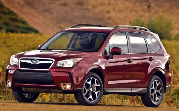 A red Subaru Forester angular front view