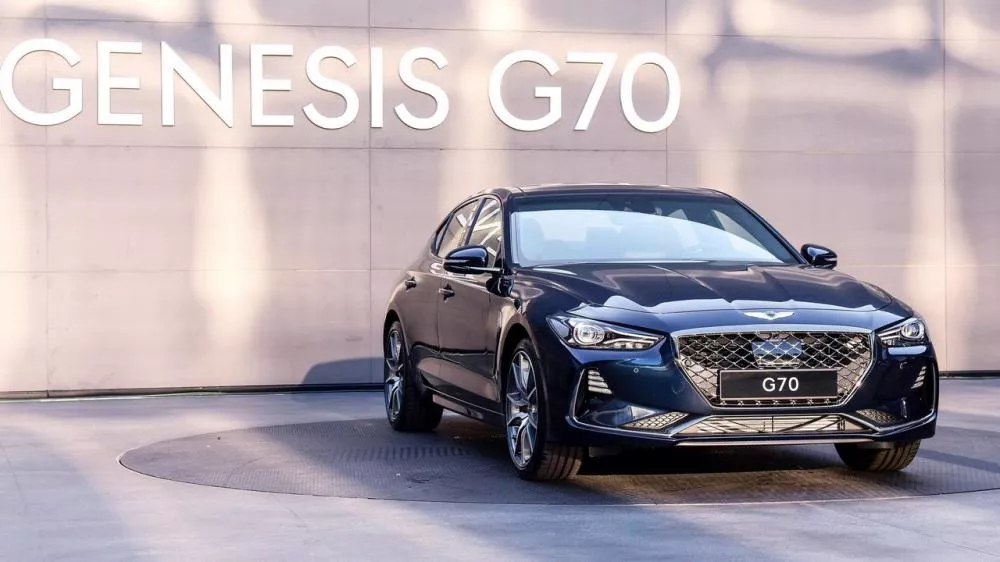 A blue Genesis G70 on display