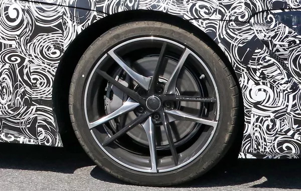 The wheel of the camoflaged Toyota Supra 2019