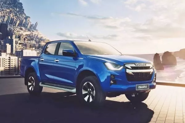 A picture of the Isuzu D-Max under the sun with a twisted city-scape as a background