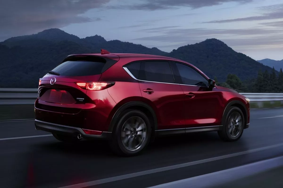We share the same engine options as the JDM CX-5 so chances of us getting the same updates are good A picture of the rear of the JDM CX-5 travelling on the road