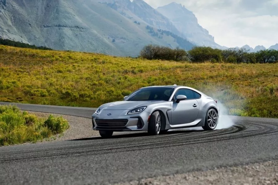 A picture of the 2022 Subaru BRZ drifting on a lonely country road