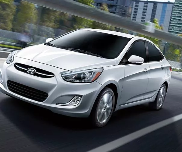 A white Hyundai Accent on the road