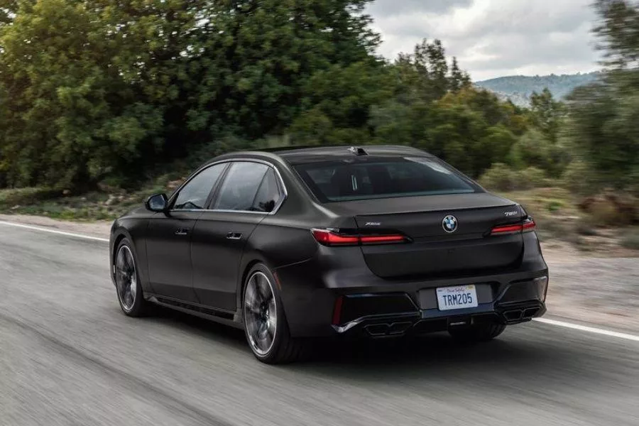 A picture of the rear of the 2023 7 Series as it drives on the highway
