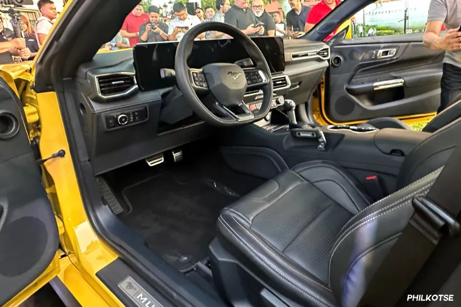 It features a 13-inch central touchscreen display