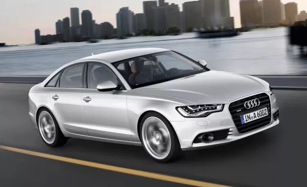 Audi warns that if not repaired, the overheated coolant pump can catch fire. angular front of a silver Audi A6