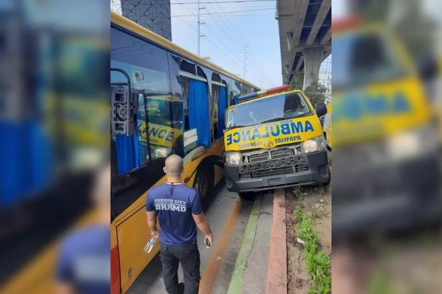 A picture of a bus and ambulance in an accident on EDSA