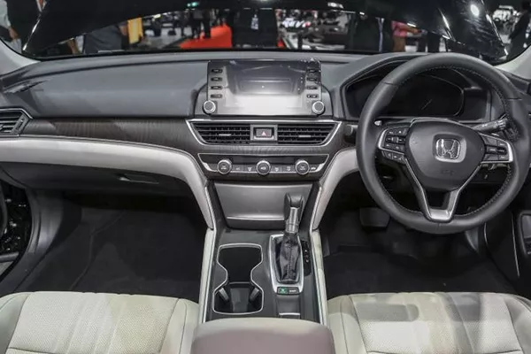 A picture of the new Honda Accord's interior highlighting the infotainment system and the faux wood dash