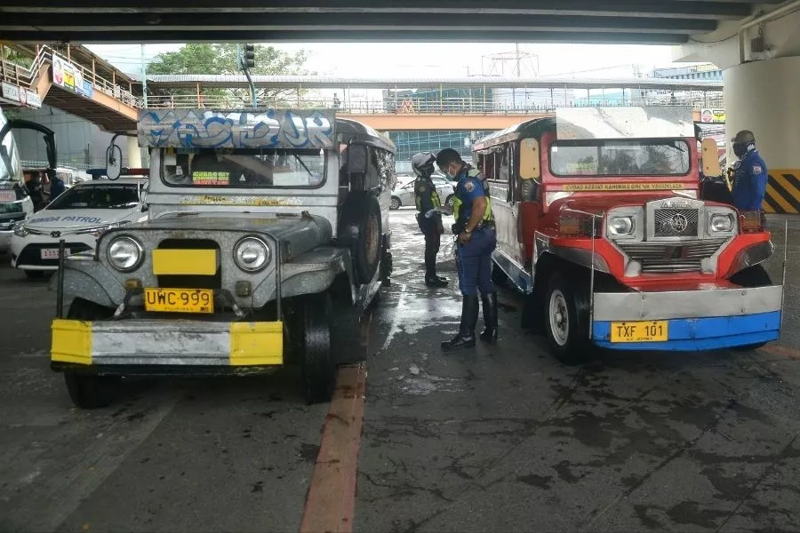 Enforcers inspecting jeepneys