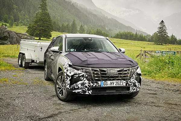 A picture of the new Hyundai Tucson in the Austrian Alps with a trailer.