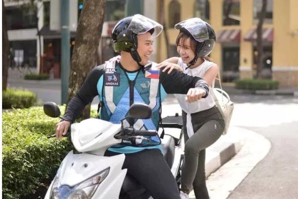 Angkas rider and his passenger