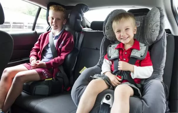 two kids using child car seats