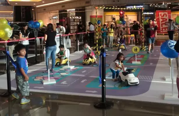 Children learning traffic rules through playing with toy cars