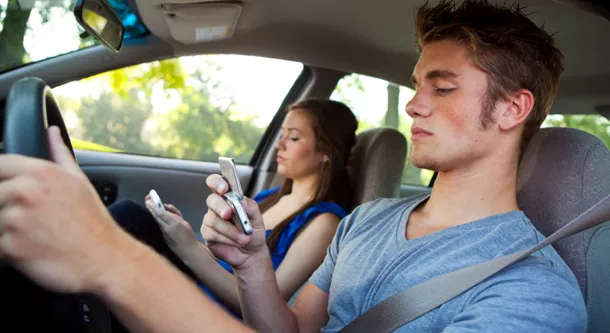 A man texting while driving