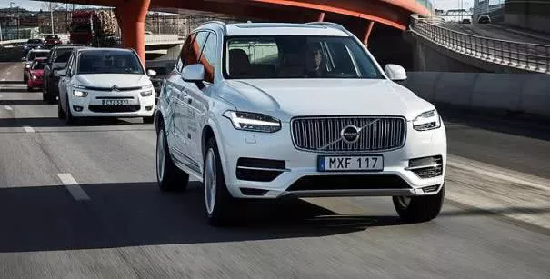 A white Volvo plying on street