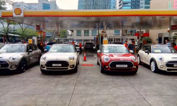 Four cars parked at the Shell Gas station