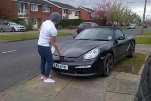 Porsche Boxster Louis Tomlinson standing in front of his car
