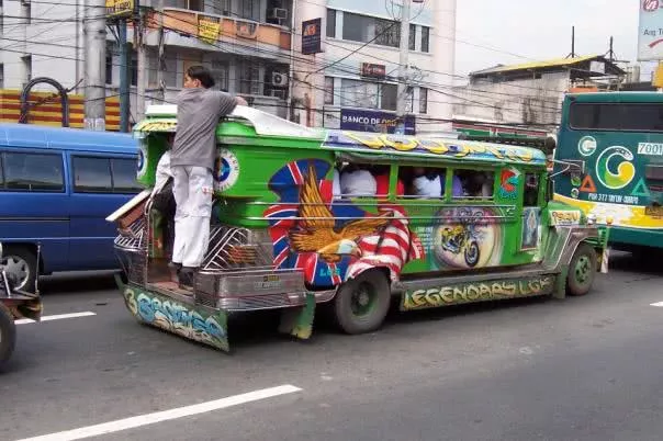 Landbank has established a credit facility, costing P1-billion, to assist PUJ operators in the initial phase of the program A man clinging to a jeep