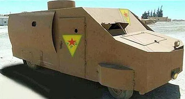 Yellow homemade tank by the Kurds angular front view