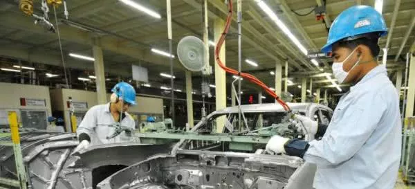 Workers in a car manufactory 