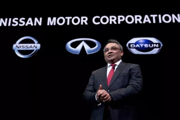 A picture of Ashwani Gupta with the Renault-Mitsubishi-Nissan logos behind