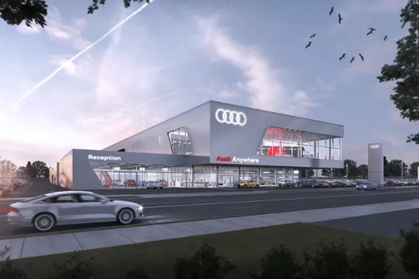 An Audi auto dealership at night