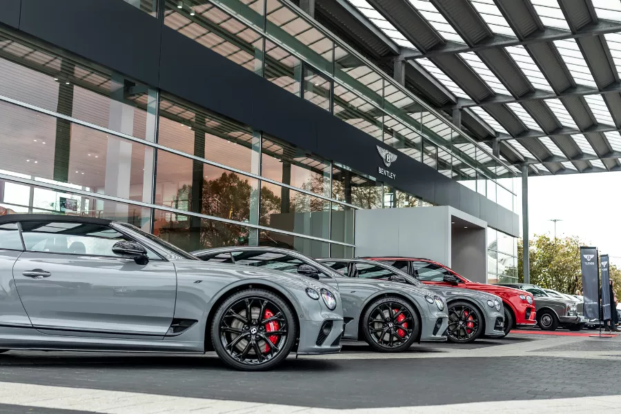 A picture of several Bentley units in front of a dealership.