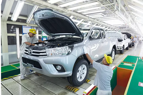 Everything, including car manufacturing is forever changed by the COVID-19 pandemic A picture of a Toyota plant assembling a Hilux
