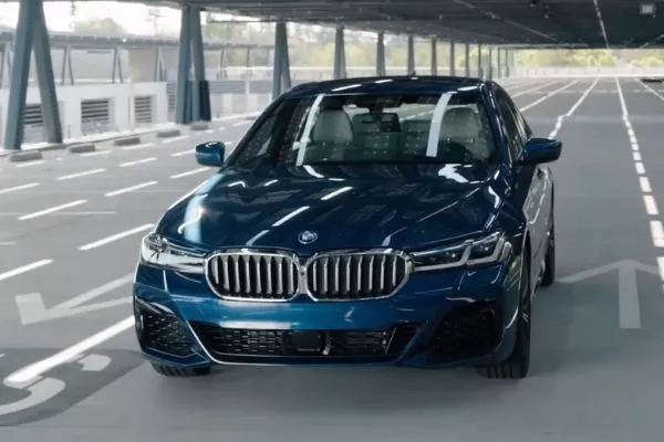 A blue BMW 5 Series