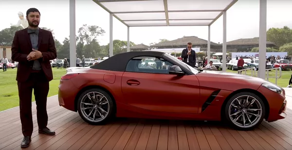 the side of the BMW Z4 2019 at Pebble Beach and a reporter